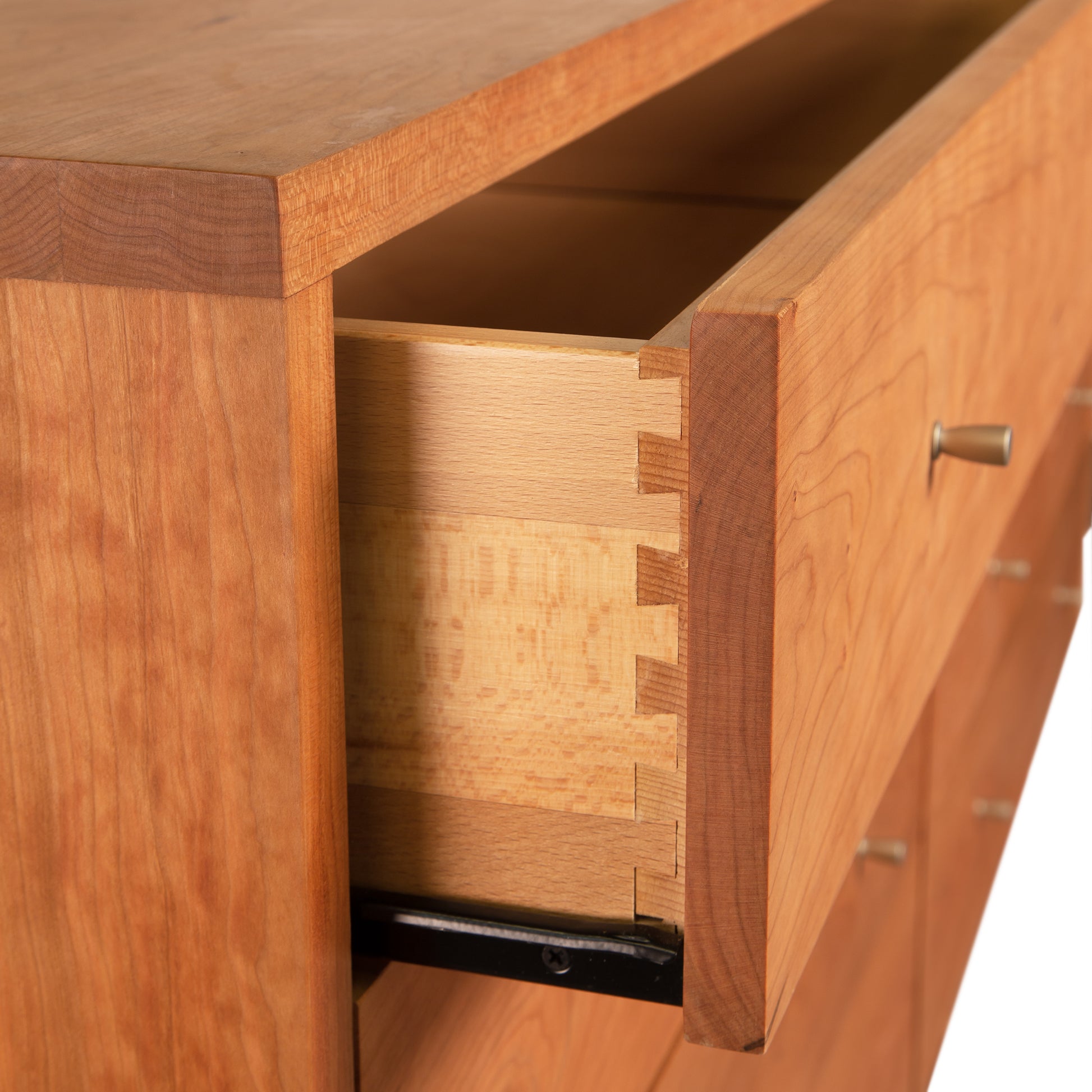 Larssen 8-Drawer Dresser by Vermont Furniture Designs with dovetail joints and sleek metallic handles, showcasing fine craftsmanship and elegant design.