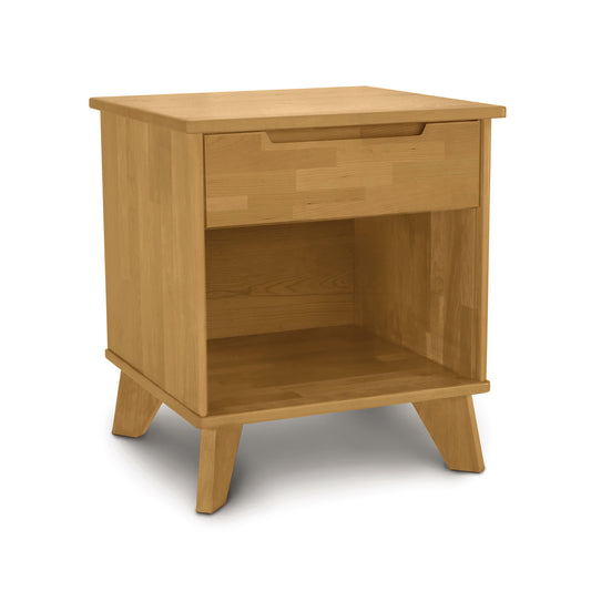 Copeland Furniture Linn nightstand with a natural wood finish, featuring a drawer, open shelf, and distinctive angled legs.
