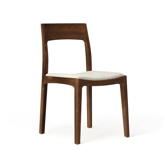 Lisse Dining Chair by Copeland Furniture in solid wood with a curved backrest and light gray upholstered seat, handcrafted in Vermont.