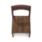 Lisse Dining Chair by Copeland Furniture with curved backrest showcasing the grain of black walnut.