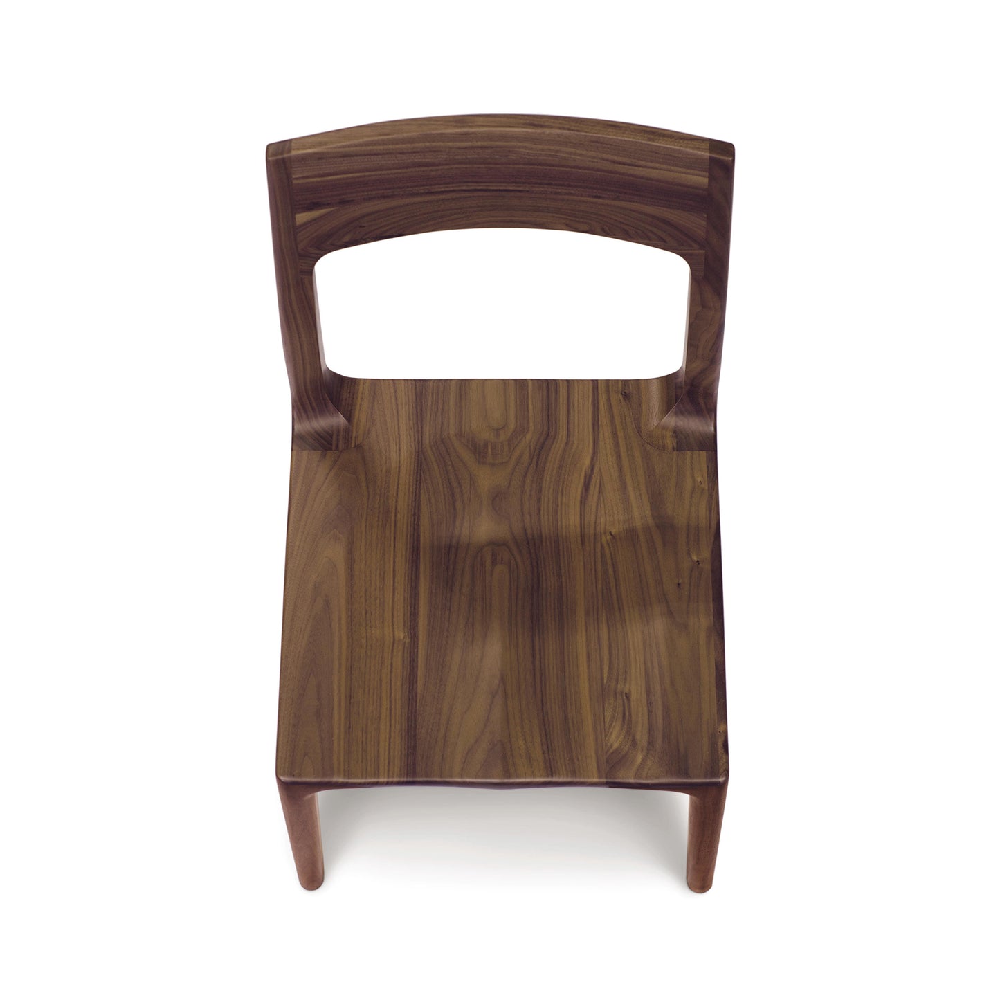 Lisse Dining Chair by Copeland Furniture with curved backrest showcasing the grain of black walnut.