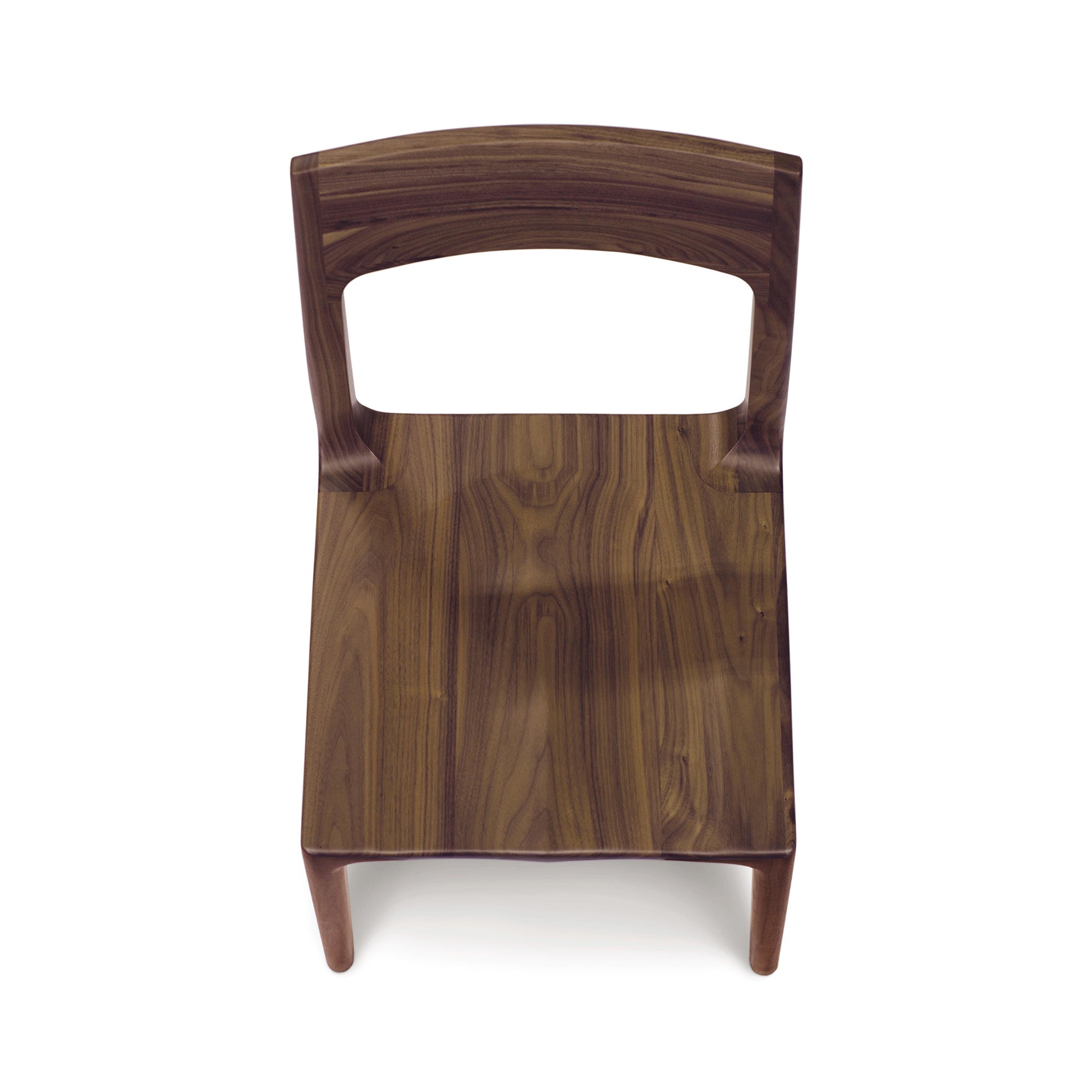 Lisse Dining Chair by Copeland Furniture with curved backrest showcasing the grain of black walnut.