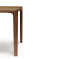 Copeland Furniture Lisse Dining Chair in walnut, highlighting its sleek minimalism.