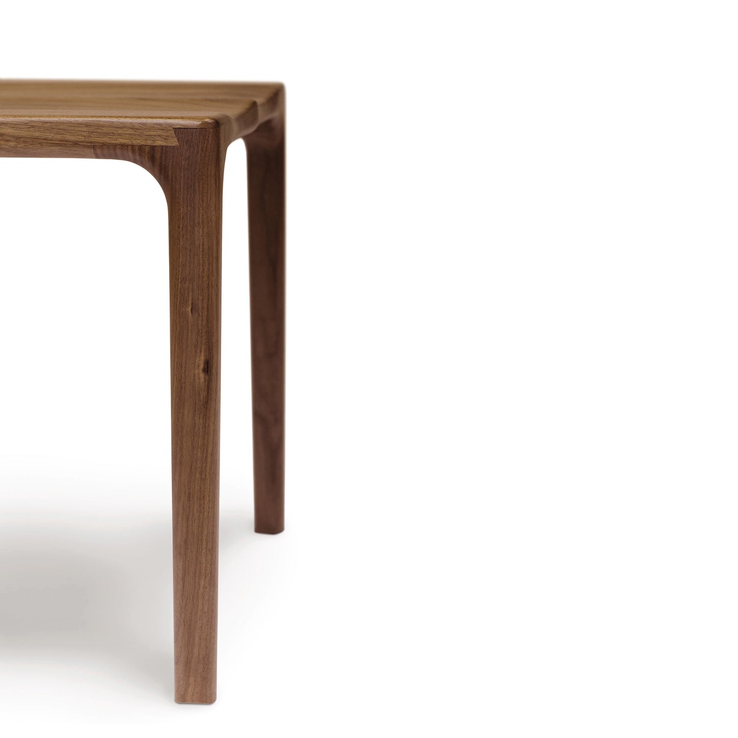 Copeland Furniture Lisse Dining Chair in walnut, highlighting its sleek minimalism.