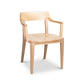 The Ludlow Chair by Vermont Woods Studios, crafted in the USA, showcases elegant armrests and a curved backrest for comfortable dining.