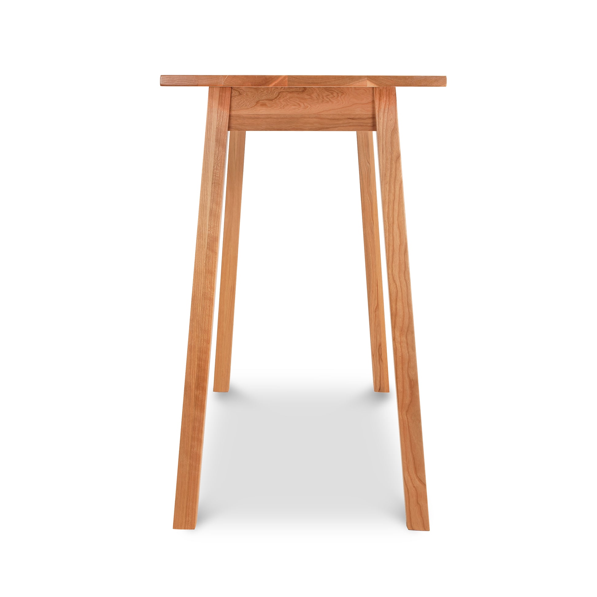 Manchester Cherry Compact Desk by Vermont Woods Studios in solid wood with four angled legs, showcasing modern American craftsmanship. Clearance item.