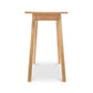 Manchester Compact Desk in light birch wood, handcrafted by Vermont Woods Studios, shown from the front to highlight its design and craftsmanship.