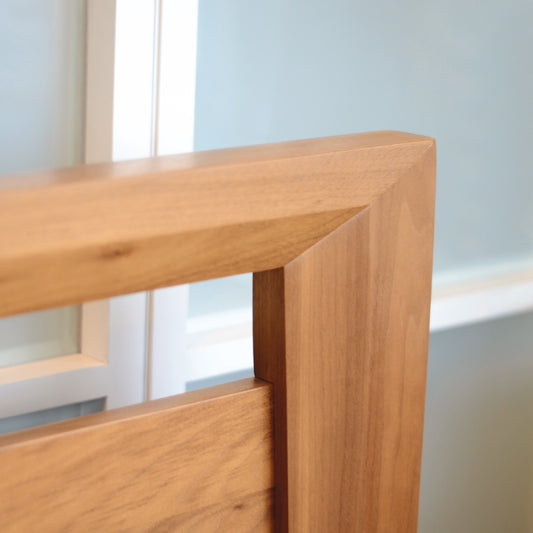 Mansfield Platform Bed corner by Copeland Furniture featuring smooth edges.