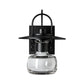 The Mason Outdoor Sconce by Hubbardton Forge showcases black metal craftsmanship, a curved arm, flat shade, and artisan clear hand-blown glass.
