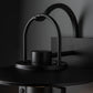 Black Mason Outdoor Sconce by Hubbardton Forge, showcasing elegant curved lines and subtle Steampunk design, American crafted quality.