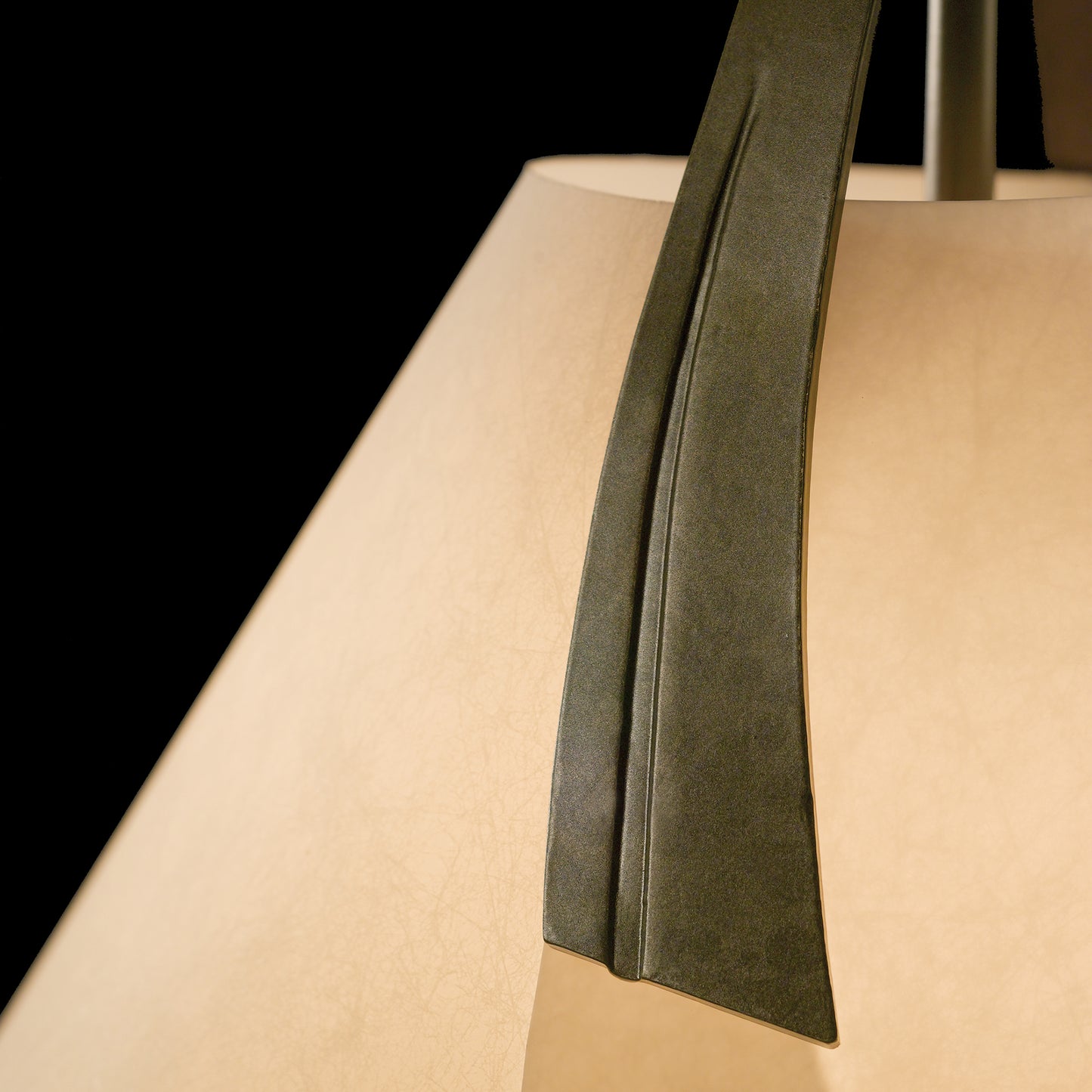 Mobius Small Pendant by Hubbardton Forge featuring smooth, curved metal accent.