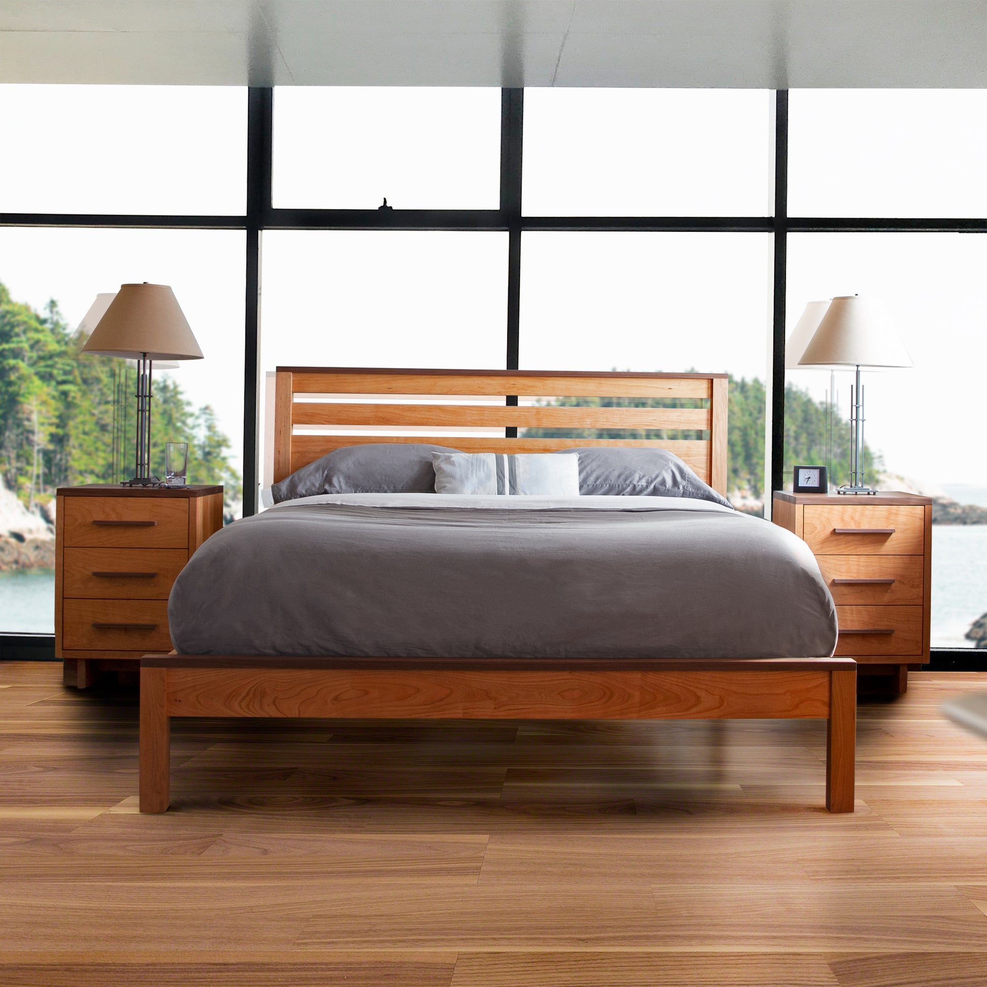 Solid wood bed with gray bedding paired with Vermont Furniture Designs 3-drawer nightstands, showcasing premium American-made craftsmanship.