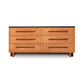 Vermont Furniture Designs Modern American 6-Drawer Dresser with light brown finish and dark handles.