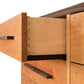 Modern American 8-Drawer Dresser with metal handles and dovetail joints by Vermont Furniture Designs.