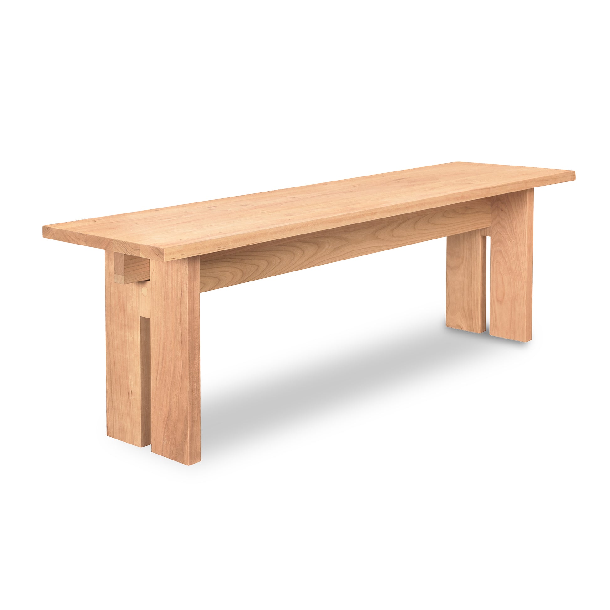Sleek light wood Vermont Furniture Designs Modern American Bench with eco-friendly oil finish and distinctive cut-out leg details.