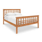 Modern Craftsman High Footboard Bed with lattice headboard and white bedding.