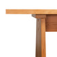 Modern Designer Sofa Table by Lyndon Furniture features a thick tabletop, angled leg, and stunning wood grain, showcasing expert American craftsmanship.