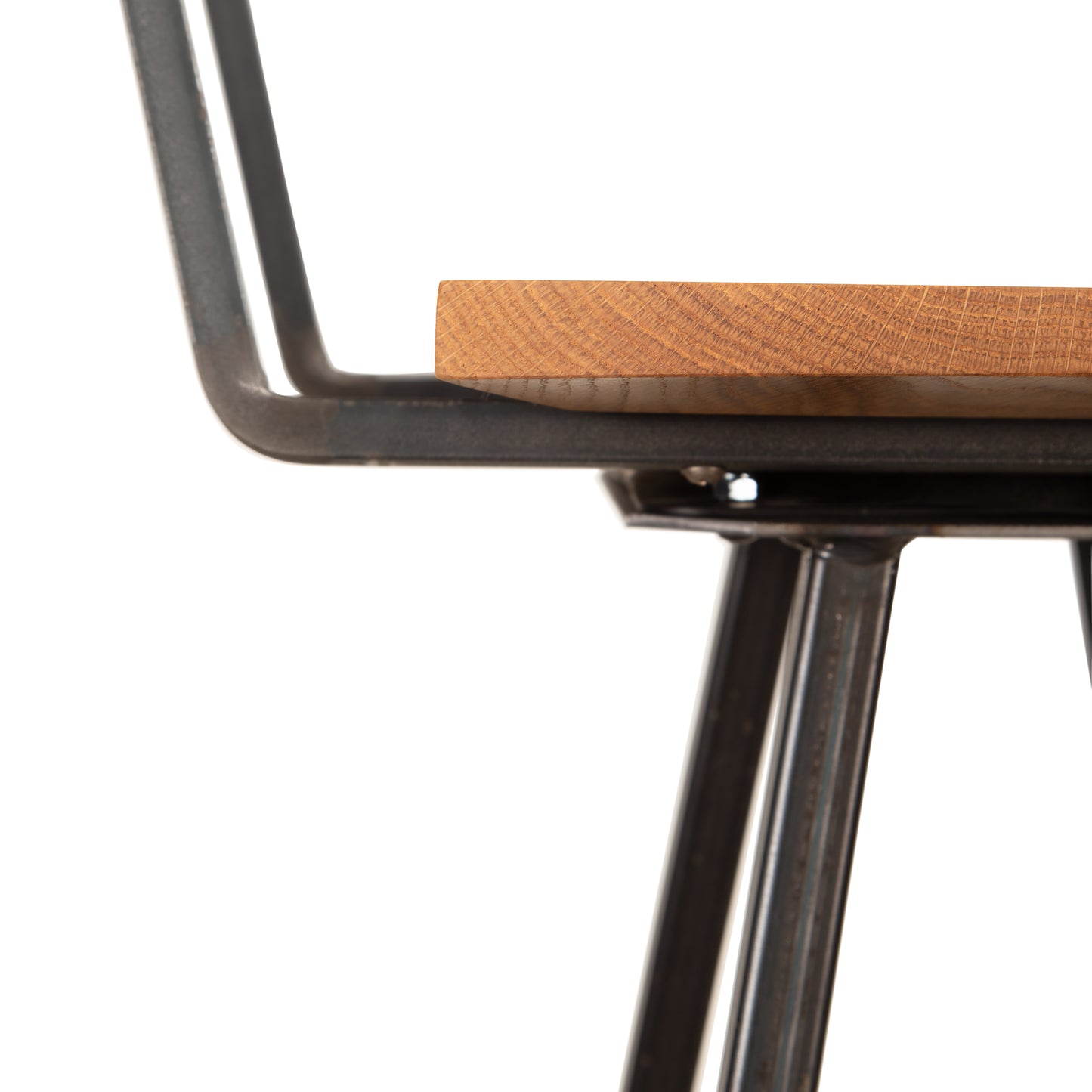 Vermont Woods Studios Modern Industrial Bar Stool with Back in Oak, featuring a solid wood seat and sturdy metal legs, shown in close-up.