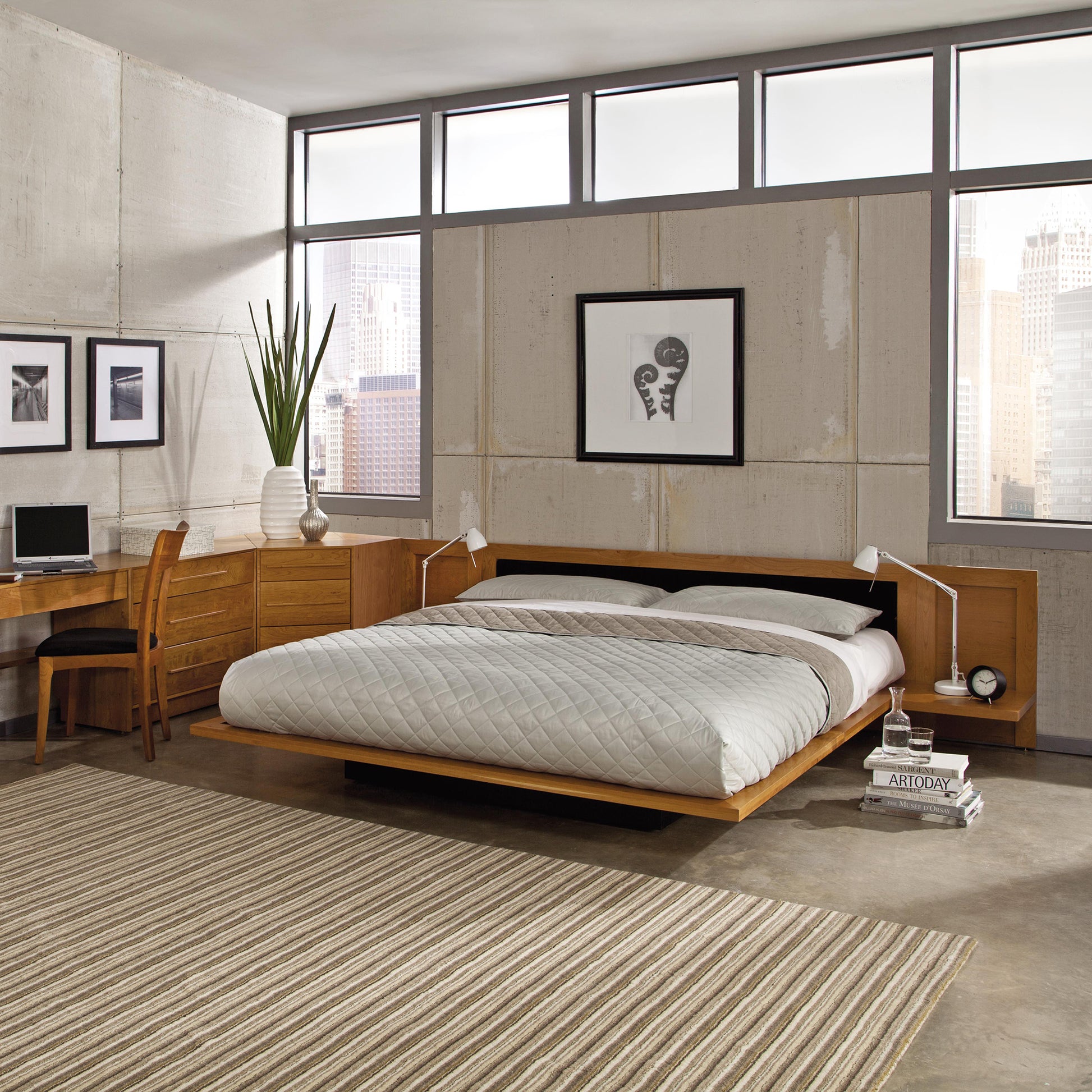 Copeland Moduluxe Platform Bed with 29" upholstered headboard, paired with a matching desk and chair in a modern bedroom setting.