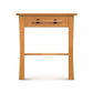 Copeland Furniture Monterey nightstand in solid cherry wood with black handles and slightly curved legs.