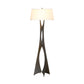 The Moreau Floor Lamp by Hubbardton Forge, featuring a hand-forged metal base and white drum shade, embodies contemporary elegance in American-made furniture.