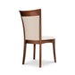 Morgan Shaker Chair by Copeland Furniture with beige upholstered backrest and seat, shown angled from behind to highlight craftsmanship.