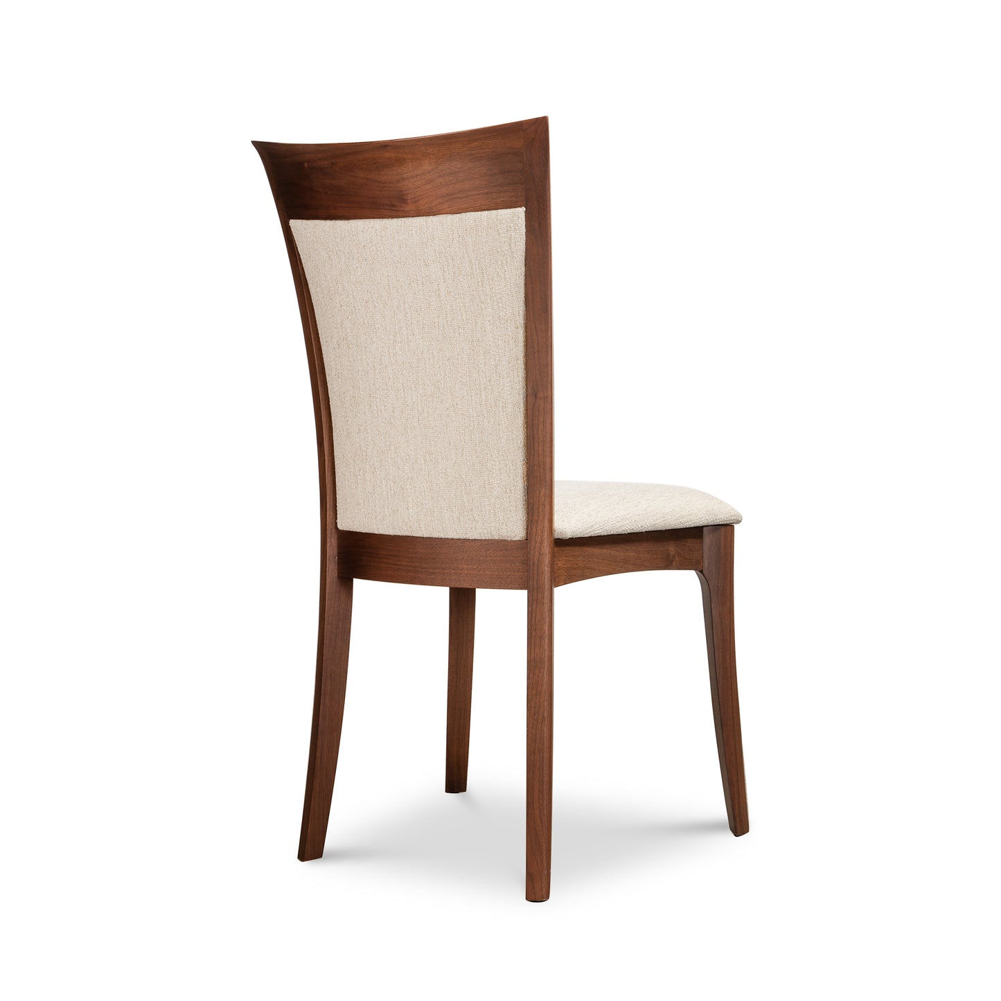 Morgan Shaker Chair by Copeland Furniture with beige upholstered backrest and seat, shown angled from behind to highlight craftsmanship.