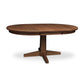 Lyndon Furniture Natural Vermont Single Pedestal Round Extension Table, handcrafted from solid wood, featuring an elegant pedestal base and smooth round top.