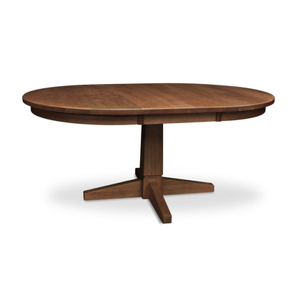 Lyndon Furniture Natural Vermont Single Pedestal Round Extension Table, handcrafted from solid wood, featuring an elegant pedestal base and smooth round top.