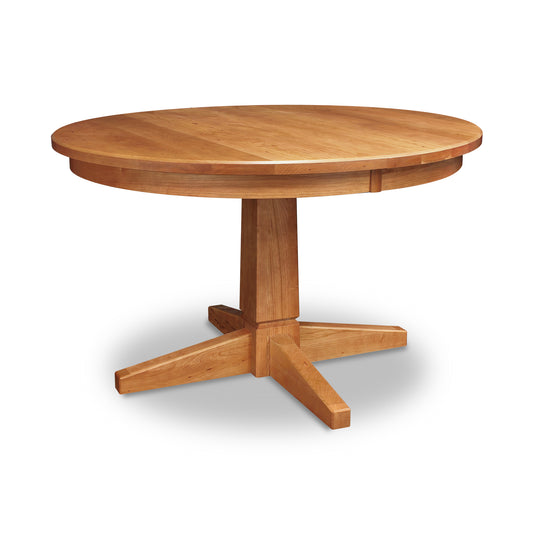 Lyndon Furniture Natural Vermont Round Table with solid wood top and sturdy single pedestal base, shown in handcrafted finish.