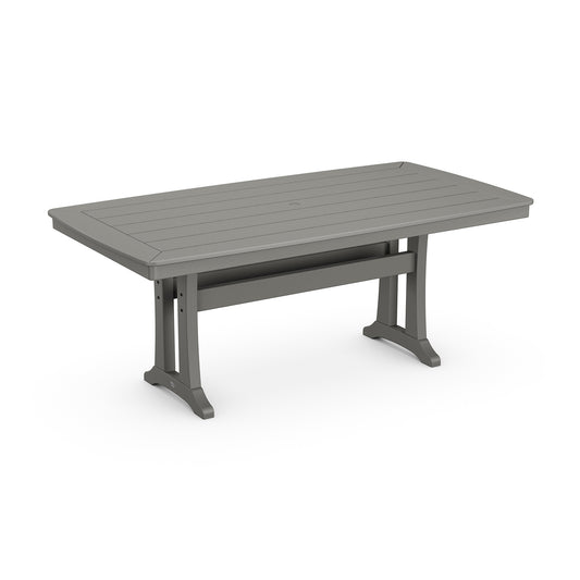 Weather-resistant gray POLYWOOD Nautical Trestle Dining Table featuring a slatted top and sturdy legs.