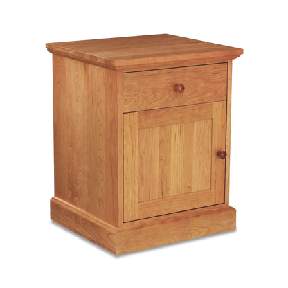 New England Shaker nightstand by Lyndon Furniture, crafted from solid hardwood with one drawer, door, and classic round wooden knobs.