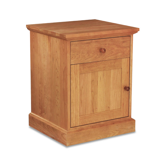 New England Shaker nightstand by Lyndon Furniture, crafted from solid hardwood with one drawer, door, and classic round wooden knobs.