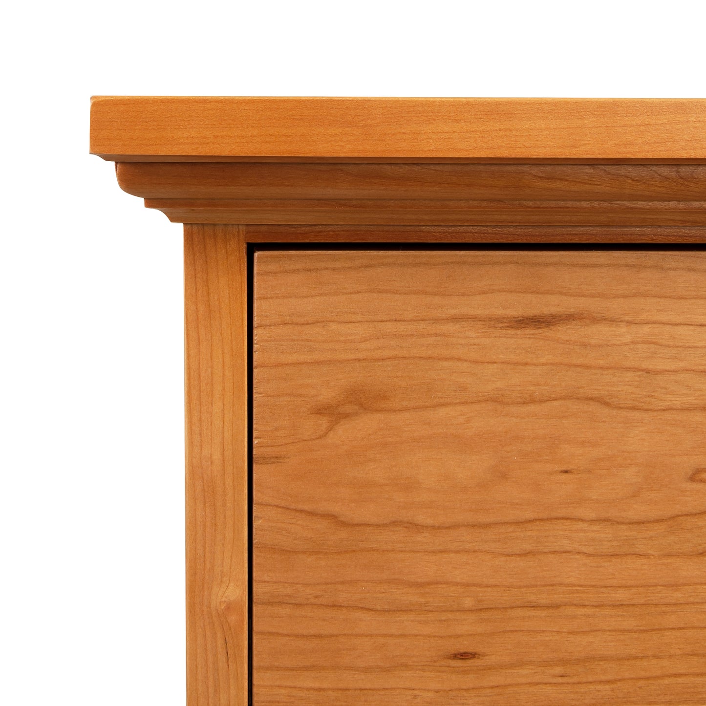 Detail view of Lyndon Furniture New England Shaker 3-Drawer Nightstand showcasing arched base and polished wood finish.