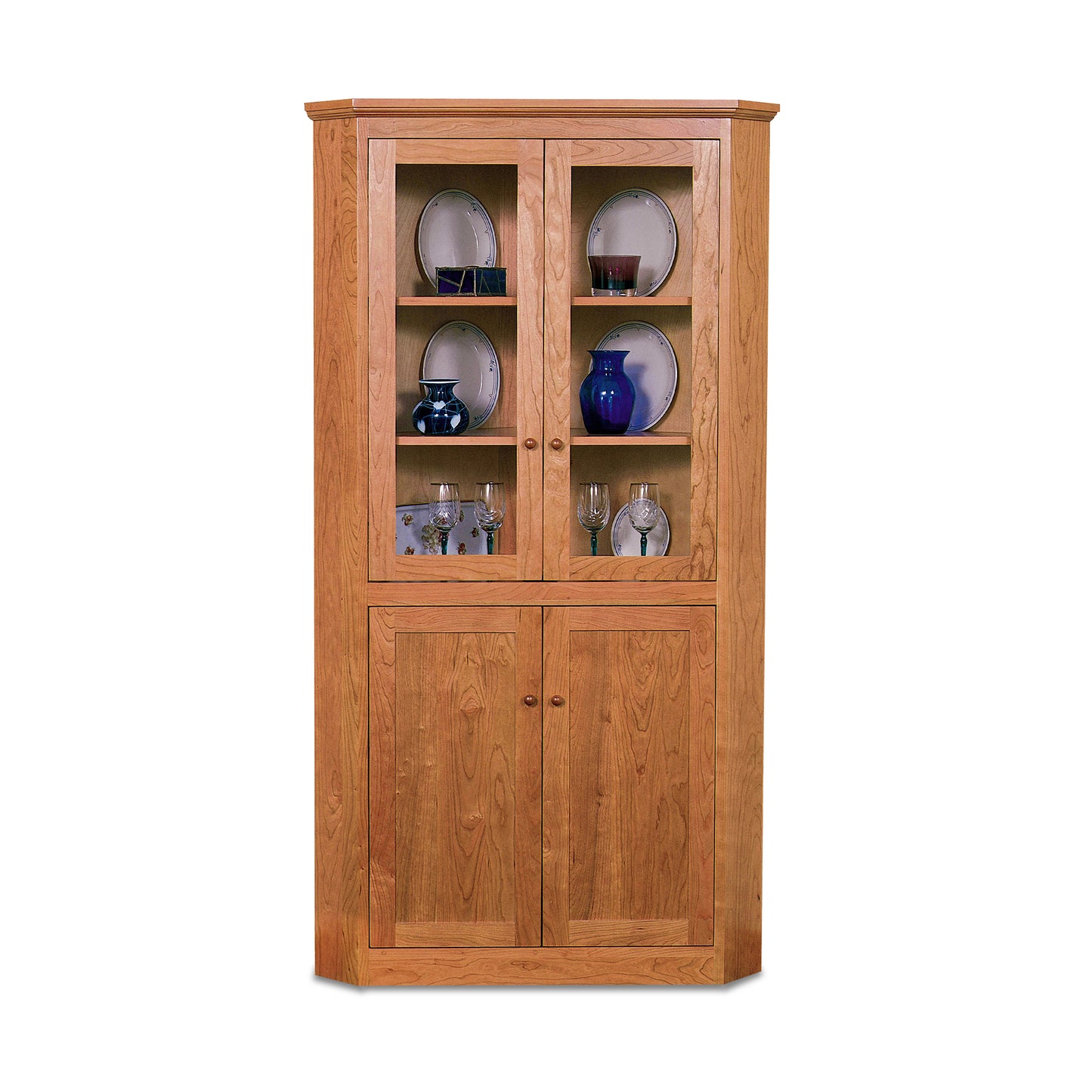 Lyndon Furniture New England Shaker Corner Cabinet with glass doors, expertly crafted from sustainably sourced wood, showcasing classic American craftsmanship.