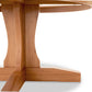 Handcrafted wooden base and legs of the Lyndon Furniture New Traditions Round Pedestal Table, highlighting fine craftsmanship.