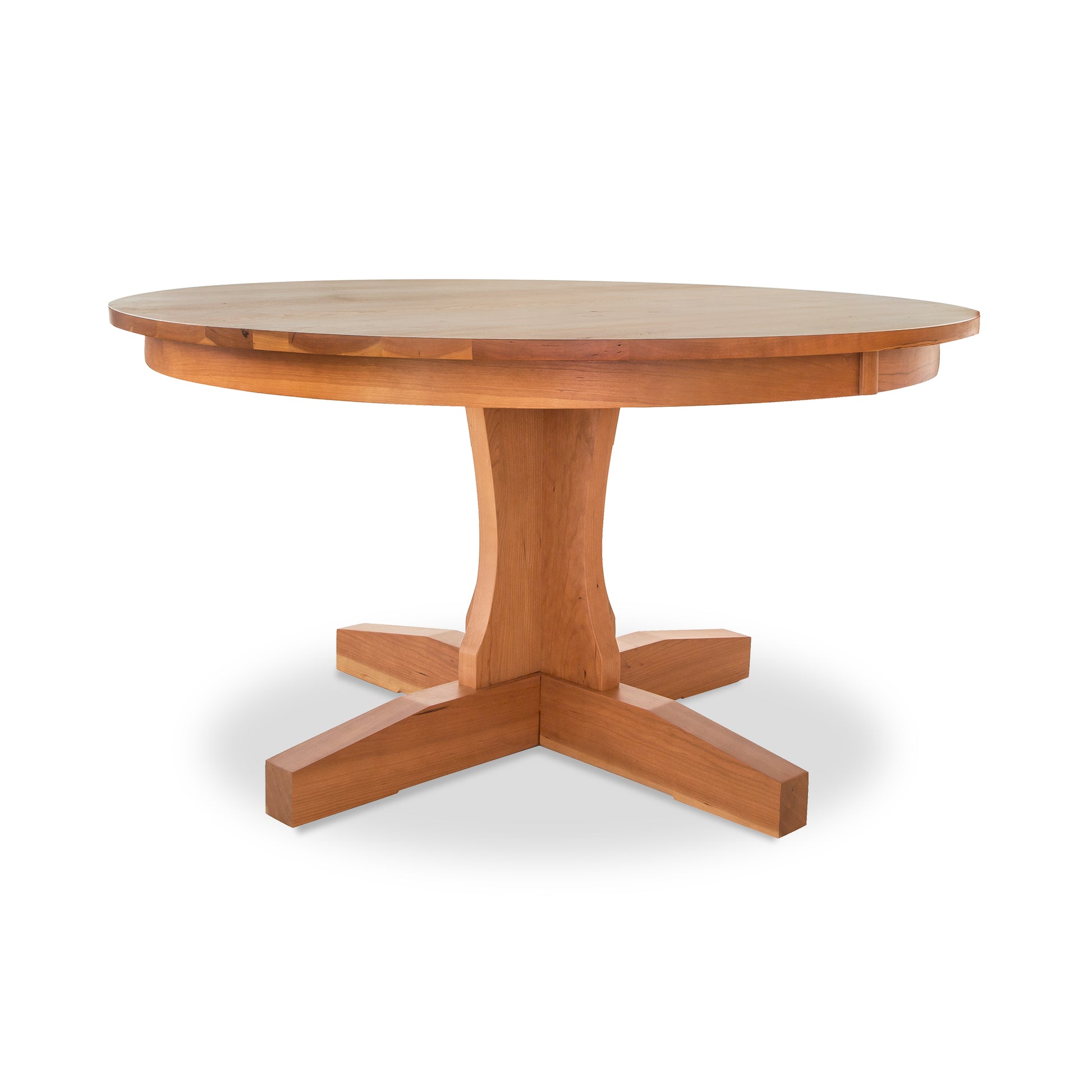 Lyndon Furniture New Traditions Round Pedestal Table with a thick hardwood top and sturdy base, showcasing elegant American craftsmanship.