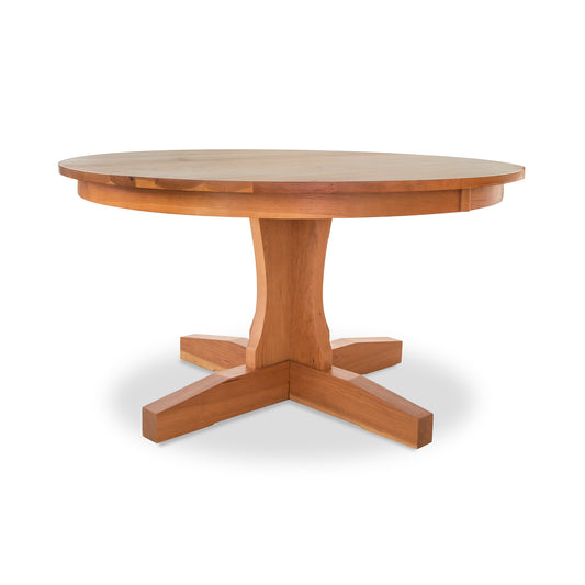 Lyndon Furniture New Traditions Round Pedestal Table with a thick hardwood top and sturdy base, showcasing elegant American craftsmanship.