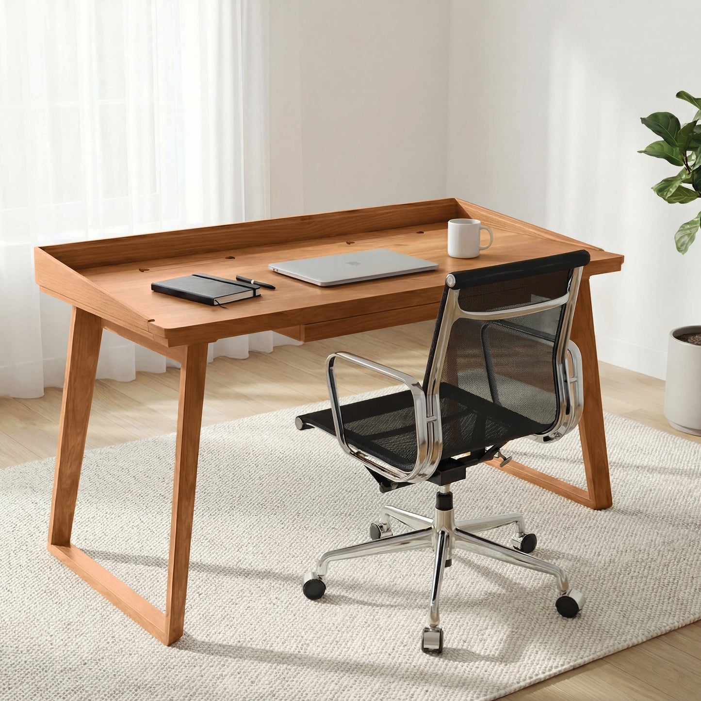 Copeland Furniture Odin Desk showcased with tech and a mug, highlighting its sleek design in an American made modern office setting.