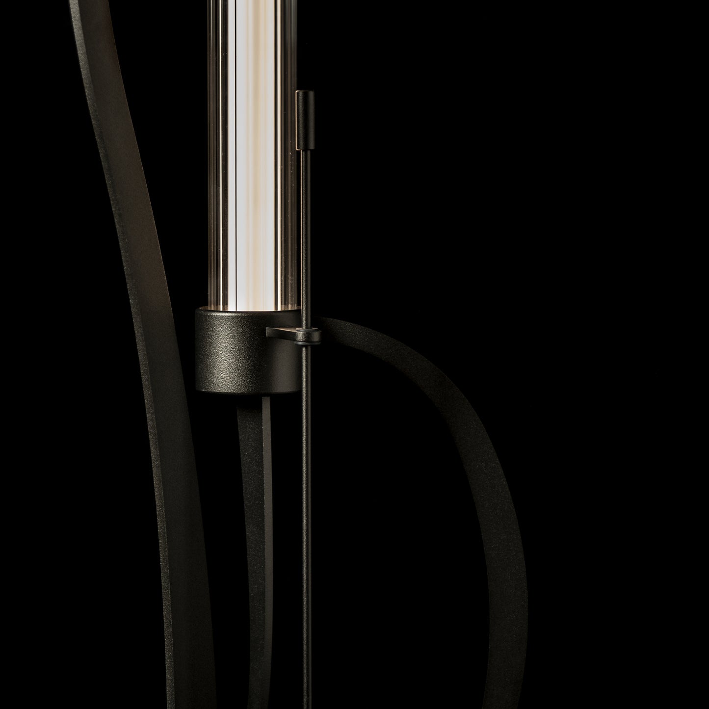Hubbardton Forge Pulse Floor Lamp with cylindrical shade and sleek black metal frame.