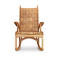 Quilted Vermont Oak Rocking Chair by Vermont Folk Rocker with woven seat, curved armrests, and sled-style rockers in focus.