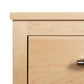 Rockingham Nightstand by Vermont Woods Studios, showing natural maple craftsmanship and a sleek silver handle on the top left corner.