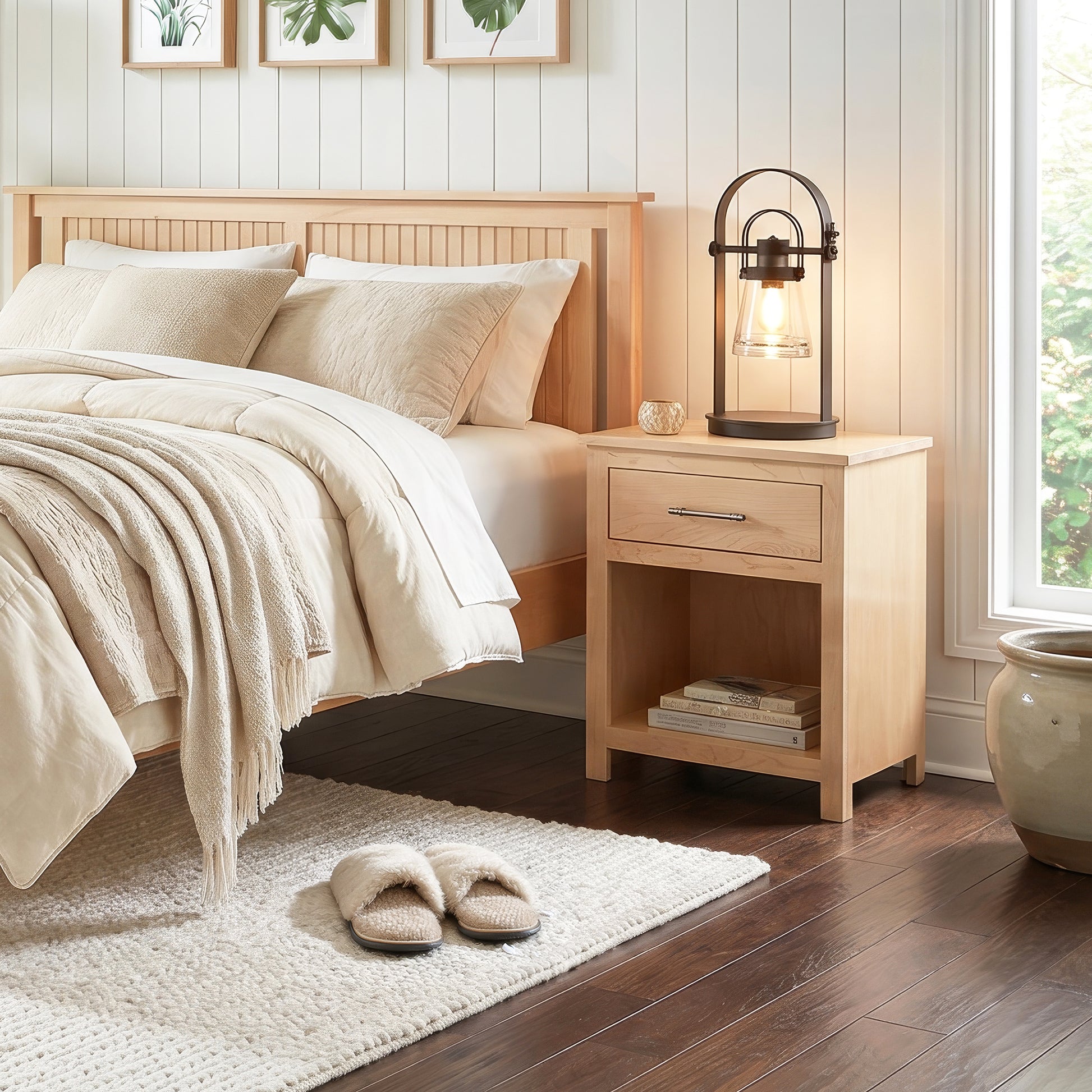 Vermont Woods Studios Rockingham Nightstand featured in a bright bedroom, paired with beige bedding on dark wood floors.