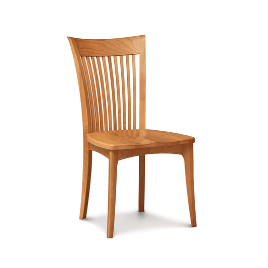 Copeland Furniture Sarah Shaker Chair crafted in American cherry with a curved slatted back and four legs, highlighting its classic hardwood design.