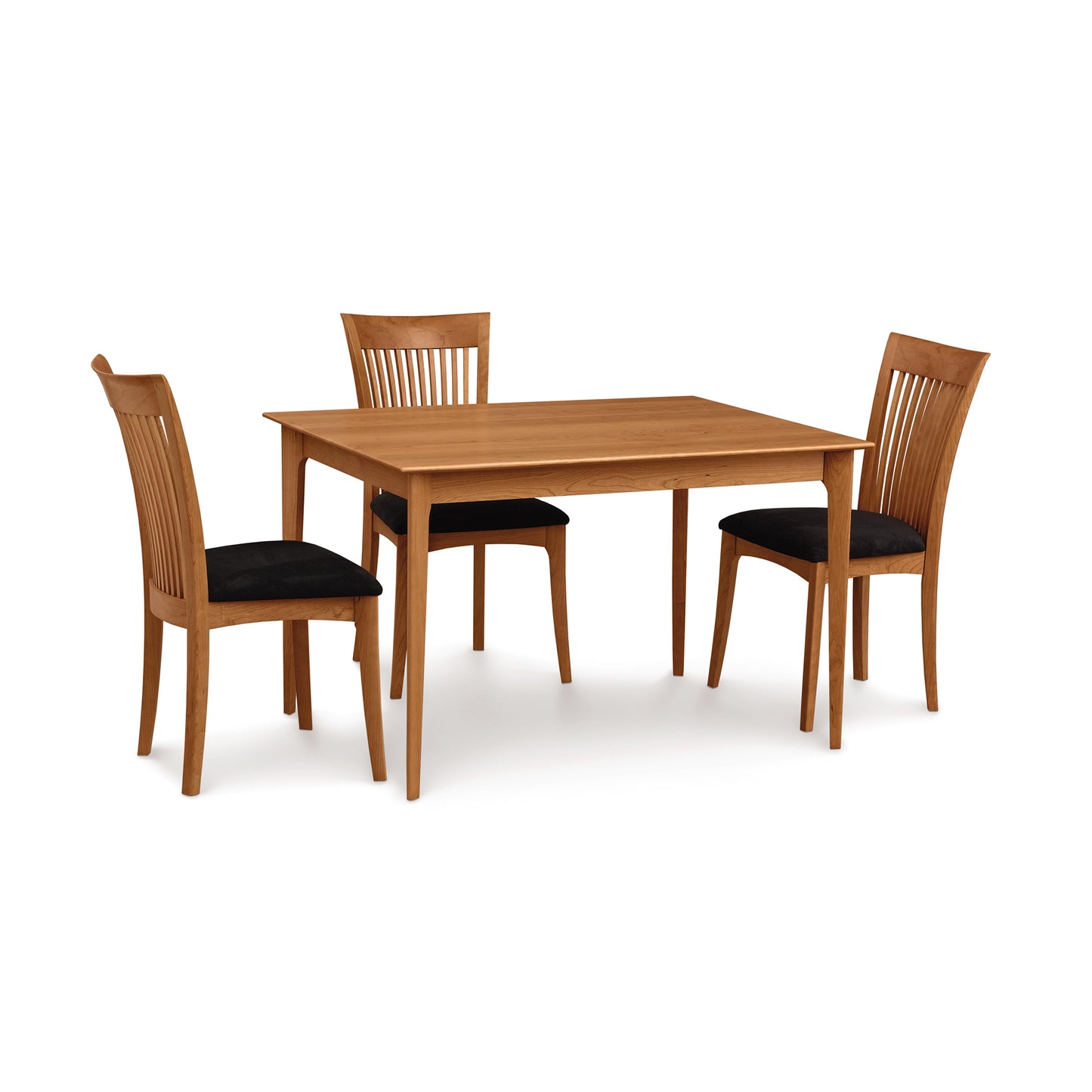 Copeland Furniture Sarah Shaker Tapered Leg Table paired with three matching dining chairs featuring black cushioned seats.