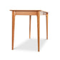 Sarah Return with Keyboard Tray by Copeland Furniture, featuring four straight legs and a rectangular top crafted in solid wood, shown at an angle.