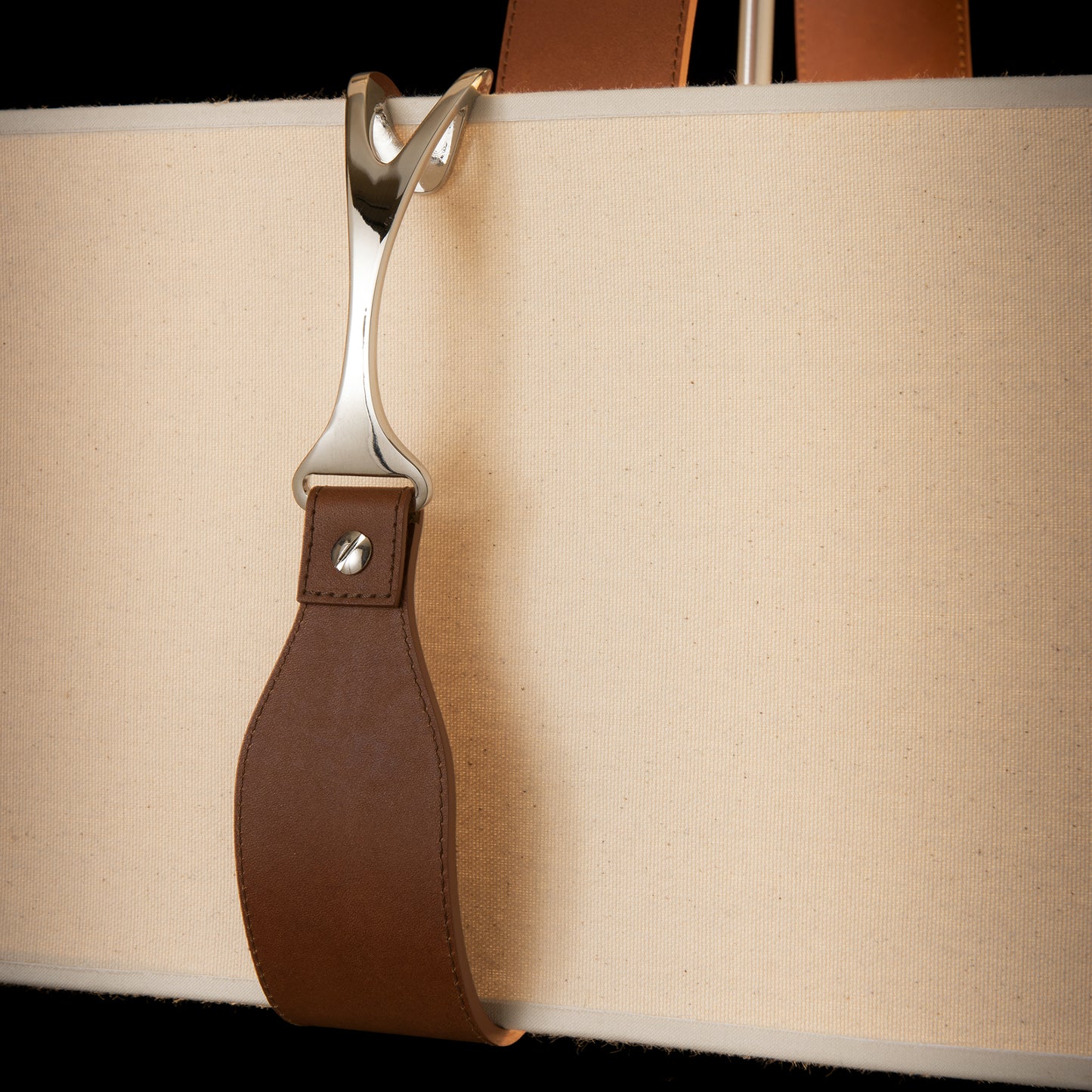 Saratoga Oval Pendant Light by Hubbardton Forge with beige canvas and brown leather accents, showcasing refined equestrian design.