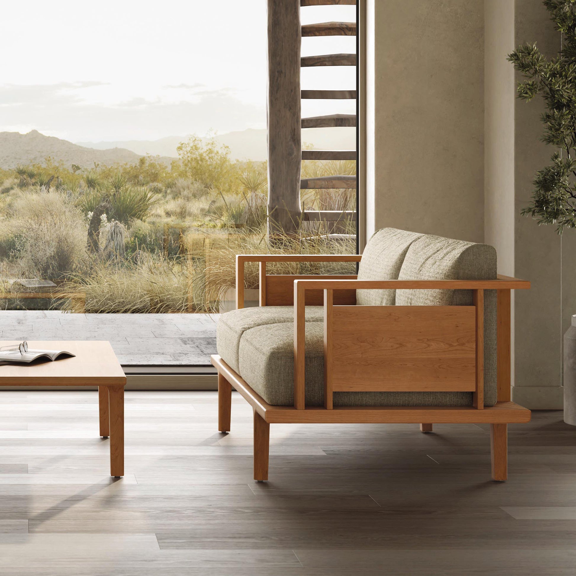 Sierra Upholstered Loveseat by Copeland Furniture with natural cherry wood frame and gray cushions.