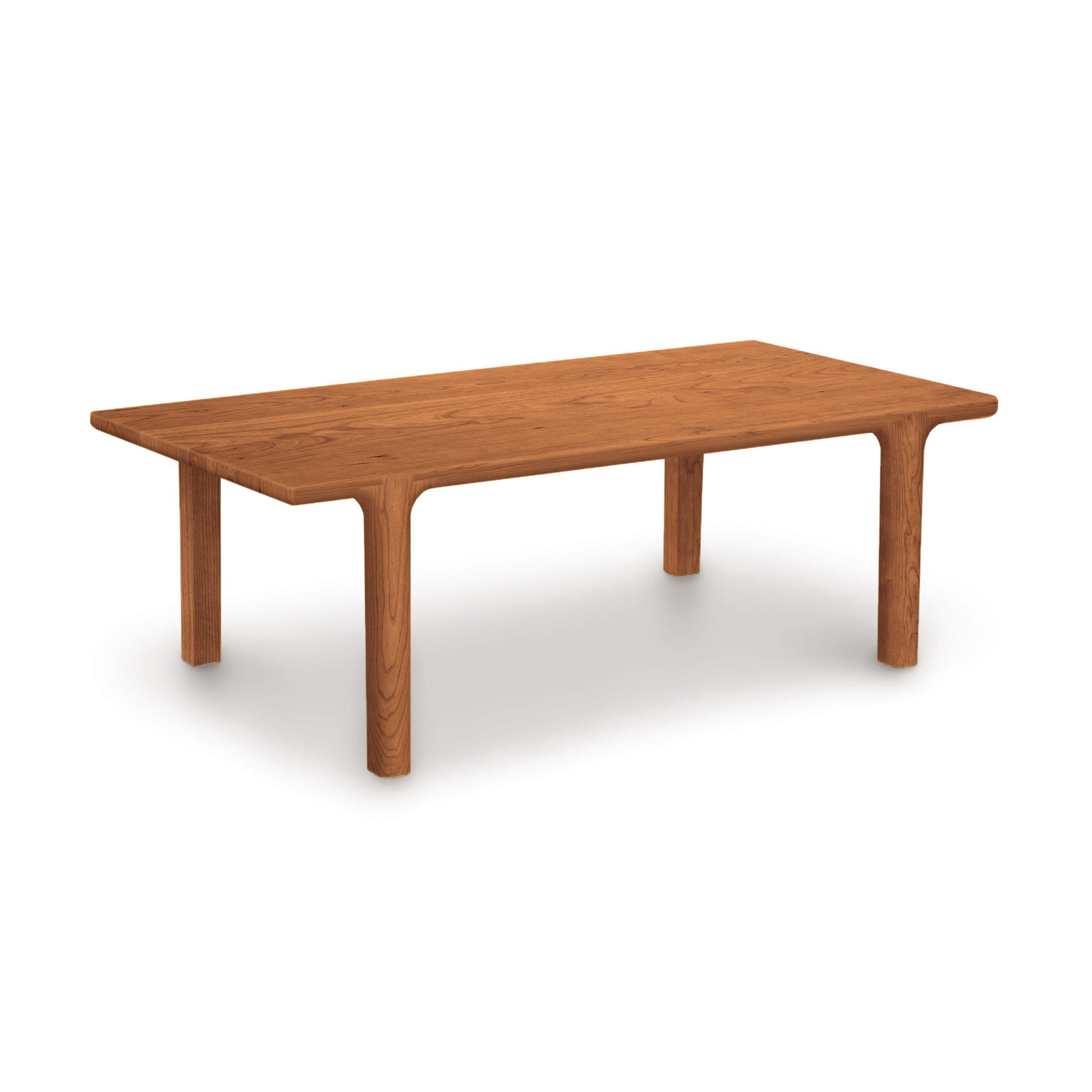 Sierra Rectangular Coffee Table by Copeland Furniture with rounded corners and thick legs, showcasing sleek, modern craftsmanship.