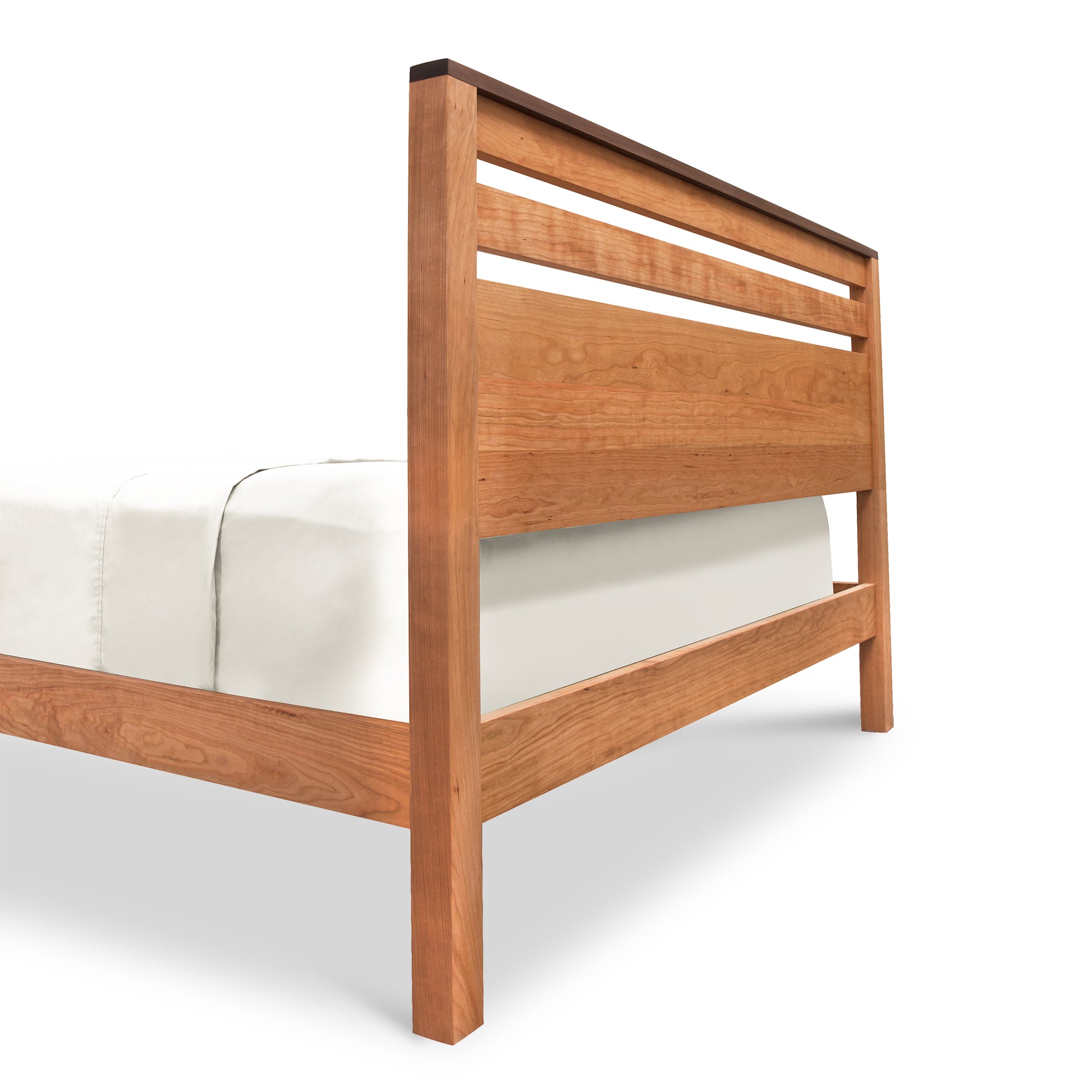 Skyline Panel Bed - Queen by Vermont Furniture Designs with a natural cherry slatted headboard, showcased from a back corner angle.